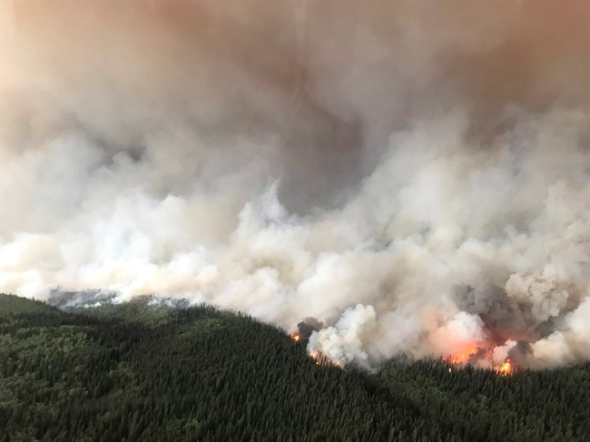  The South Stikine River fire burns in an Aug.6, 2018 handout photo provided by the BC Wildfire Service. The BC Wildfire Service says its priority is to protect homes and properties in a northwestern B.C. community already hammered by a wildfire. THE CANADIAN PRESS/HO-BC Wildfire Service