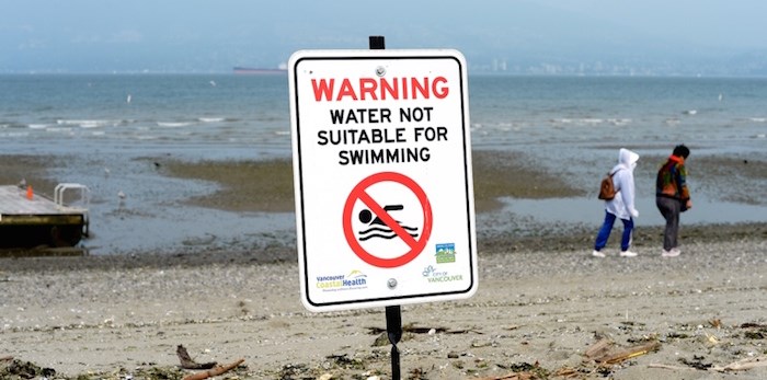  Signs advising people to stay out of the water went up at Jericho Beach, as well as English Bay and Sunset beaches, over the weekend after high levels of E. coli were detected in the water. Photo Jennifer Gauthier