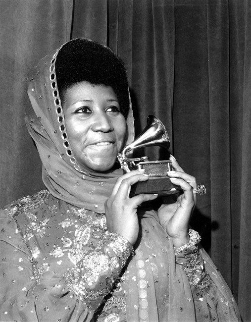  In this March 3, 1975 file photo, singer Aretha Franklin poses with her Grammy Award for for best female R&B vocal performance for 