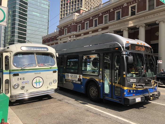  The vintage trolleybus next to an operating TransLink trolleybus in front of Waterfront Station (Lindsay William-Ross/Vancouver Is Awesome)