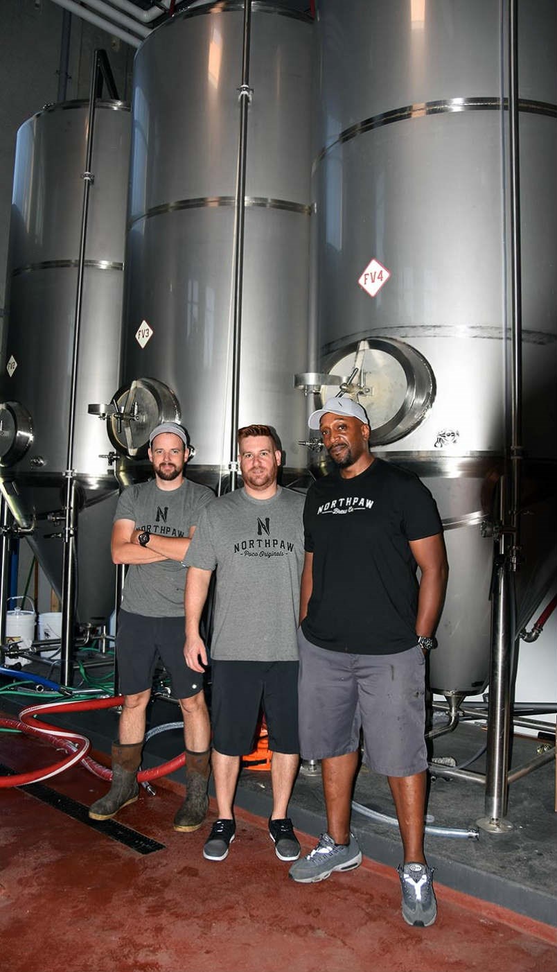  Northpaw Brew Co.’s Dennis Smit (head brewer), Will Armstrong and Courtney Brown.