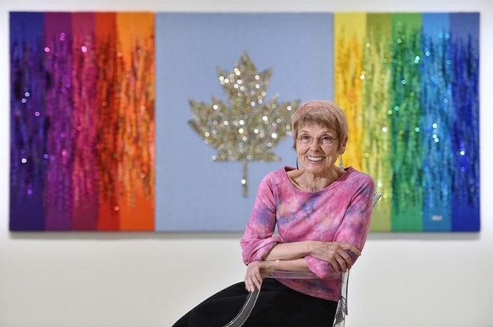  Artist Sola Fiedler in 2017 with her 'Canada 150' tapestry – a handwoven 4'x8' rendering of the Canadian flag made from recycled clothing.