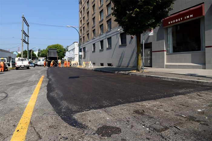  City crews paved over a section of exposed wooden pavers on Dunlevy Street have they were damaged by the sun and posed a safety risk. Photo Jennifer Gauthier