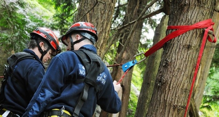  District of North Vancouver Fire and Rescue Services members shut down access to the Lynn Canyon Suspension Bridge Saturday afternoon to rescue an 18-year-old cliff jumper. file photo Cindy Goodman, North Shore News