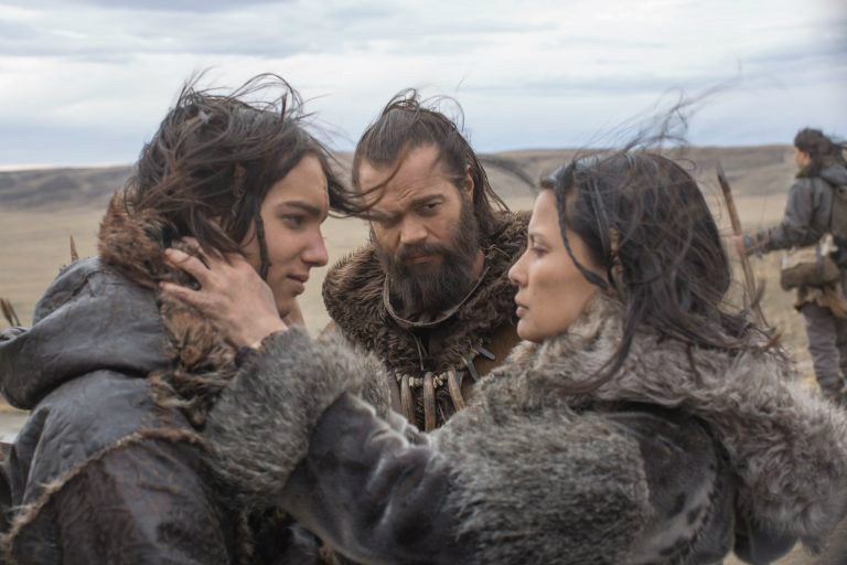  Keda (Kodi Smit-McPhee) with his father Tau (Jóhannes Haukur Jóhannesson) and his mother Rho (Natassia Malthe) in Alpha. Credit: CTMG, Inc./Alan Markfield