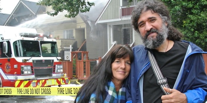  Julie Bergeron and Rosool Rasooli live in separate apartments in the house next door to the one that burned at Macdonald and West Third. Their house suffered water and smoke damage. (Photograph By MARTHA PERKINS)