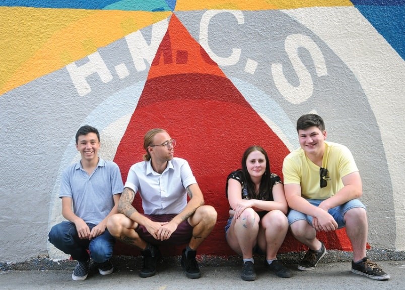  Liam McAdam, Mark Ollinger, Abby Graham and Harrison Clark in front of a section of the wall mural titled Laneway 45 at 119 East 3rd. St., North Vancouver. photo Cindy Goodman, North Shore News.