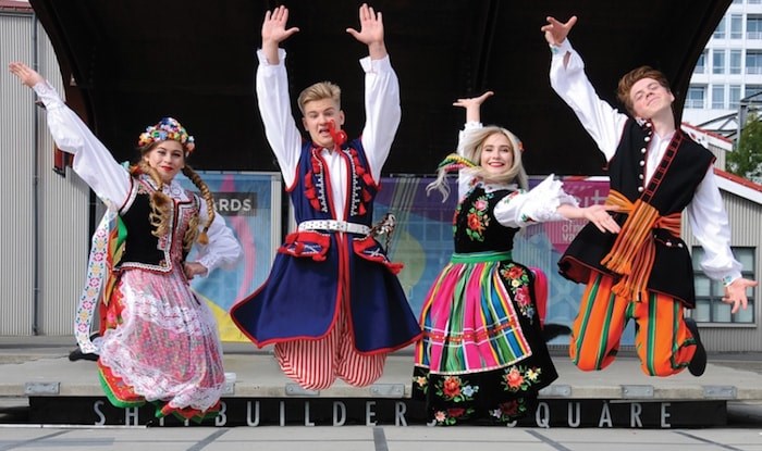  Dancers Alicja Cichecki, Patrik Slazkiewicz, Emilia Krupa and Nikodem Cichecki welcome the public to their September 9th celebration at Shipbuilders Square in Lower Lonsdale. (Photo by Cindy Goodman/North Shore News)