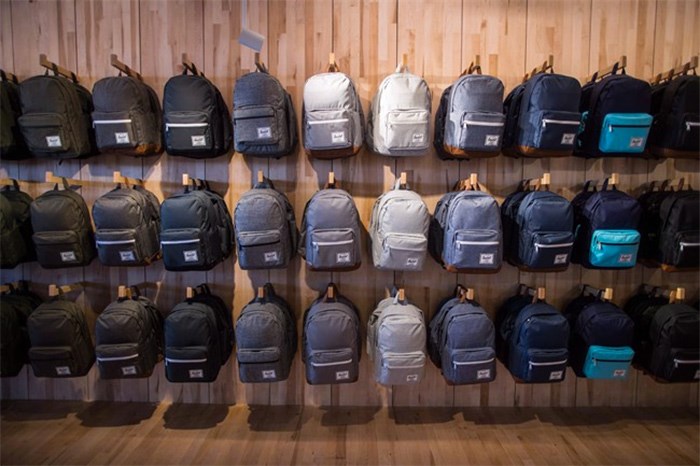  Backpacks are displayed at Herschel Supply Company's new flagship and first North American store, in Vancouver, on Monday June 11, 2018. As parents prepare to shell out hundreds of dollars on school supplies ahead of the first day of school, Canadian backpack makers readily await one of the busiest sales seasons for the industry. THE CANADIAN PRESS/Darryl Dyck