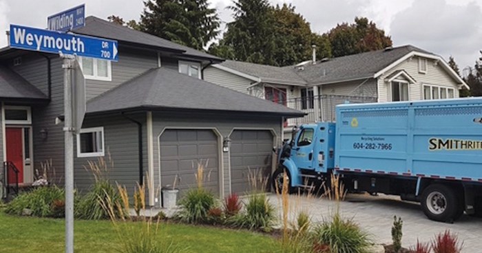  No injuries were reported after a Smithrite recycling truck plowed into a North Vancouver home. Photo supplied.