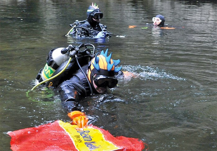  A group of nine divers from Divers for Cleaner Lakes and Oceans were cleaning up debris in the Cable Pools on the Capilano River last Saturday in co-operation with the North Shore Streamkeepers. They collected about 85 kilograms of old fishing gear and metal objects - photo Paul McGrath, North Shore News