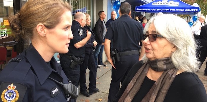  Const. Janine Tanino, the officer assigned to the Strathcona community policing centre, chats Wednesday with Judy McGuire, one of the centre’s board members. The centre at 872 East Hastings officially opened Wednesday. Photo Mike Howell