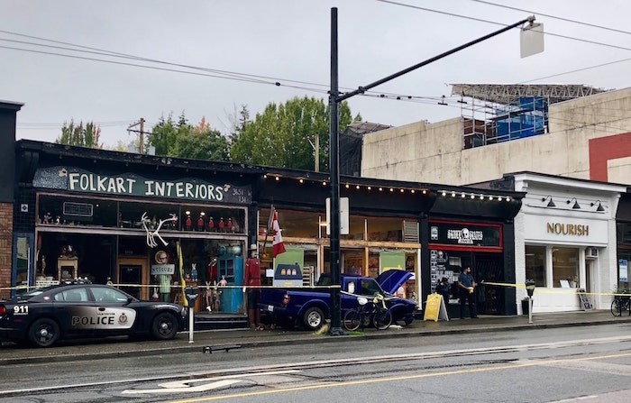  The blue truck crashed into stores after being involved in an accident West 10th Avenue and Alma Street during a Vancouver police pursuit. - Craig Roberts