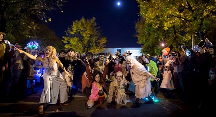  People dressed in costumes dance during the Parade of Lost Souls in Vancouver, B.C., on Saturday October 28, 2017. THE CANADIAN PRESS/Darryl Dyck