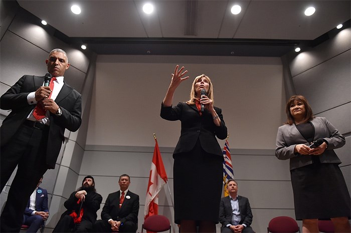  Independent candidate Shauna Sylvester (centre) has her say while Coalition Vancouver's Wei Young (right) and Fred Harding of Vancouver 1st wait their turns. Photo Dan Toulgoet