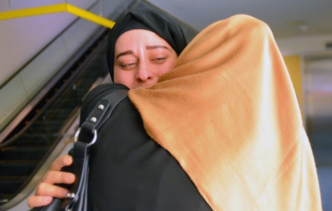  Khloud Ahmad hugs her daughter Fedaa Shebat after nearly three years spent apart. (Photograph By Cornelia Naylor)
