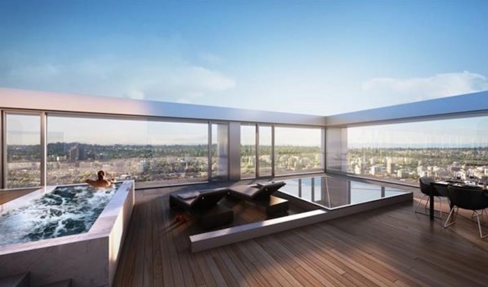  As the unit listed is south/south-east-facing, we're guessing this is a more accurate representation of the actual rooftop deck. Not too shabby... Listing agent: Karim Virani