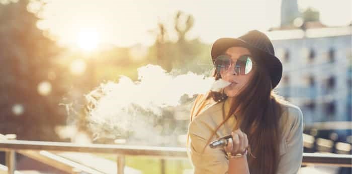  British Columbia's school trustees are asking for help to stop students from vaping. Photo: Vaping woman / Shutterstock