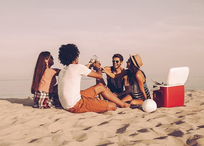  Drinking on the beach/Shutterstock