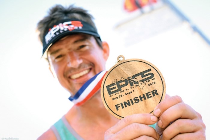  Chad Bentley shows off his hardware after completing five Ironmans in five days. Photo: Colin Cross