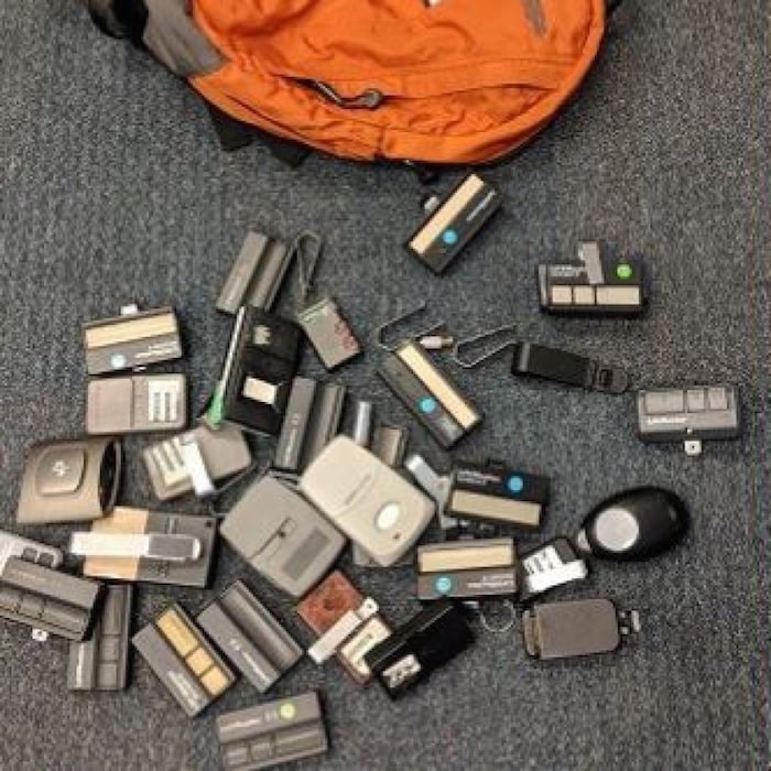  A search warrant turned up 30 stolen garage-door openers at a suspected Burnaby thief's house. Photograph By BURNABY RCMP