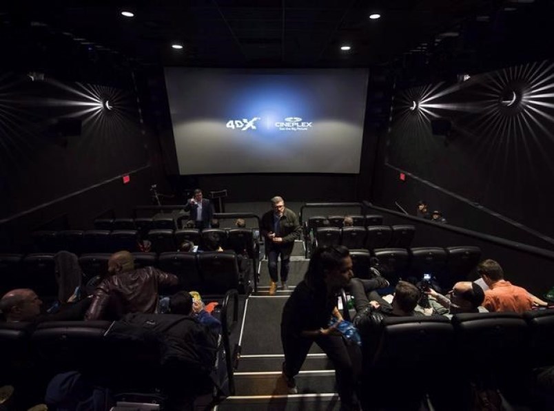  Cineplex Inc. says it has signed an agreement with immersive cinema company CJ 4DPLEX Co. Ltd. to bring 4DX technology to 13 cinemas. People mill about inside a Cineplex theatre as it opens its first 4DX sensory experience theatre which features 80 motion seats and other enhancements like water effects, snow, wind, lighting and scent in Toronto on Friday, November 4, 2016. THE CANADIAN PRESS/Nathan Denette