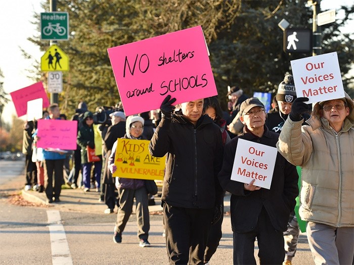  About 250 people took to the streets to protest the city’s decision to allow a 78-unit modular housing complex to be built in a Marpole neighbourhood with three schools, in 2017. Photo Dan Toulgoet