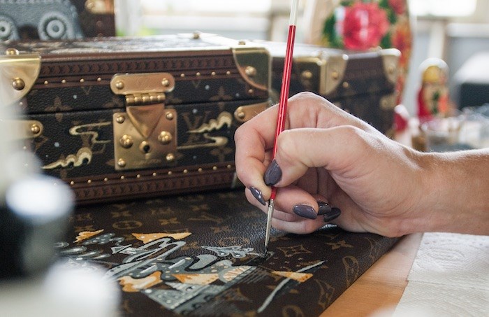  Ola Volo was chosen to paint a set of three classic Louis Vuitton trunks as part of the brand’s celebration of its 35th year in Canada. - Riaz Oozeer