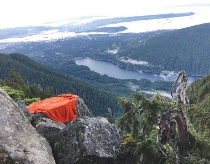  The cliff ledge overlooking the Capilano Lake where a hiker was stranded overnight Monday. photo supplied