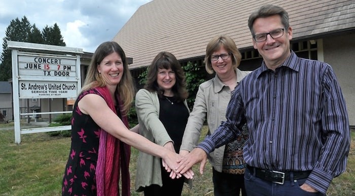  L-R, Claire MacLean, of SHARE Family and Community Services, Christine Scott of Kinsight, Julie LeBrun, the pastor at St. Andrew's United Church in Port Moody, and Robert Brown, the president of Catalyst Community Developments Society, have reason to celebrate as their proposal for a 55-unit affordable housing project on the site of the 1957 church building was approved by Port Moody council on Tuesday.