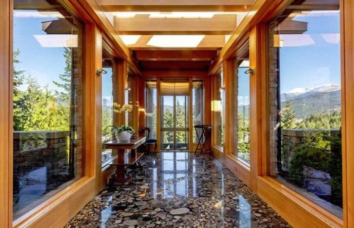  The elevator leads to this stunning glass corridor entryway. Listing agent: Viive M. Truu