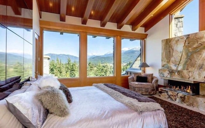  The master bedroom has breathtaking views and a cozy fireplace. Listing agent: Viive M. Truu