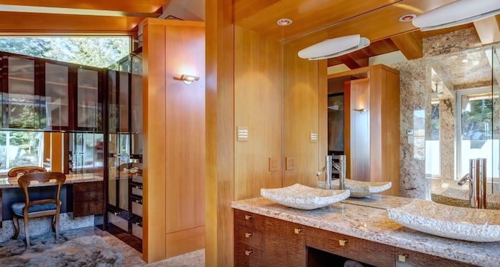  The master suite comes complete with luxurious bathroom and dressing room. Listing agent: Viive M. Truu. Image via YouTube