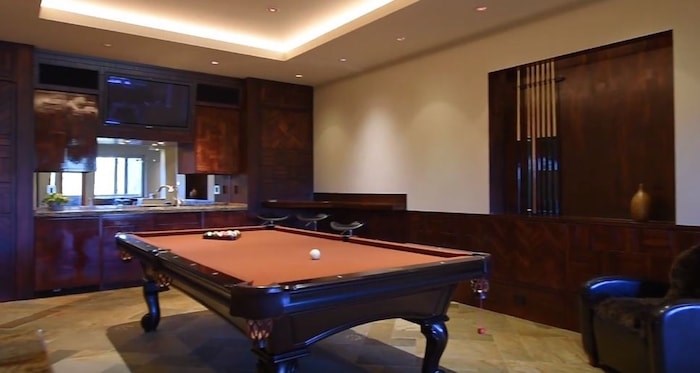  The home has a large games room with a wet bar. Listing agent: Viive M. Truu. Image via YouTube
