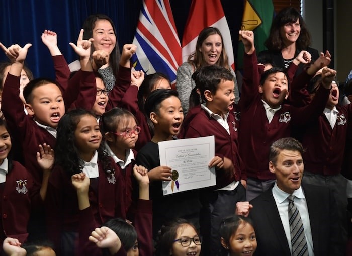  R.J. Pena surrounded by classmates and Mayor Gregor Robertson during the award ceremony October 26, 2018 (Photo by Dan Toulgoet)