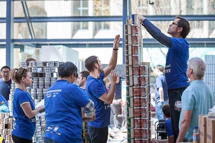  These are volunteers building weird stuff out of cans at a previous event. CONTRIBUTED