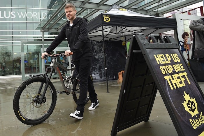  Jon McLuskie picks up his friend Remko Schrik's bike that was registered to Project 529 in Prince George, stolen in Penticton and found by police in Vancouver's Downtown Eastside. Photo Dan Toulgoet