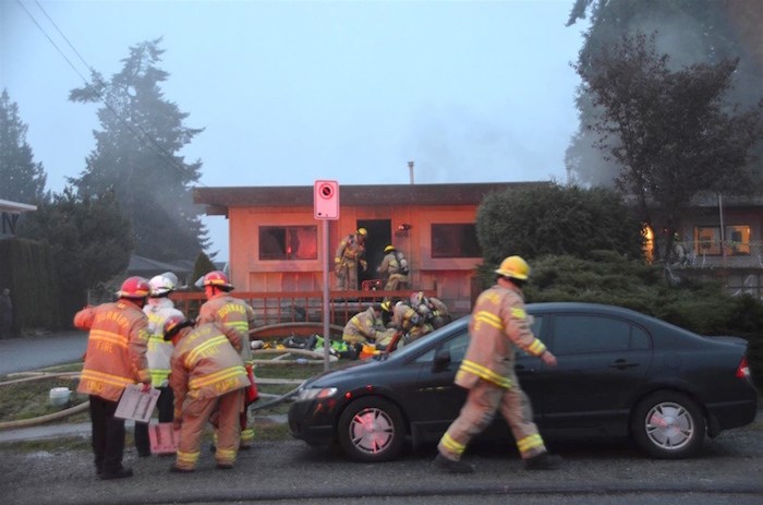  Firefighters at a house on 16th Avenue in Burnaby. Photo by Curtis Kreklau