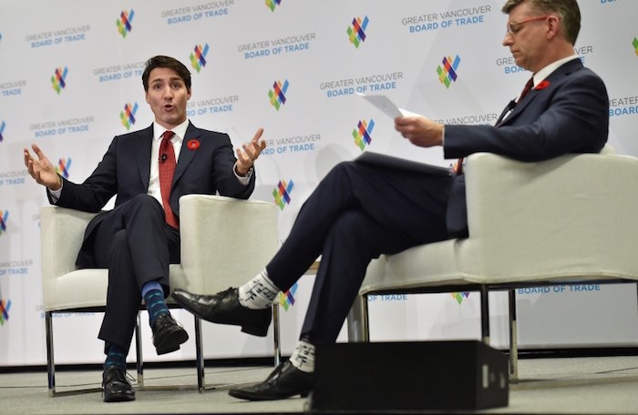  Prime Minister Justin  Trudeau speaks with Vancouver Board of Trade president and CEO Iain Black. Photo Dan Toulgoet