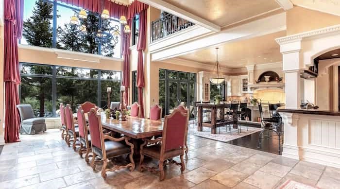  The French-style kitchen flows into a dining area with soaring ceilings and a huge lakeview window. Source: Concierge Auctions