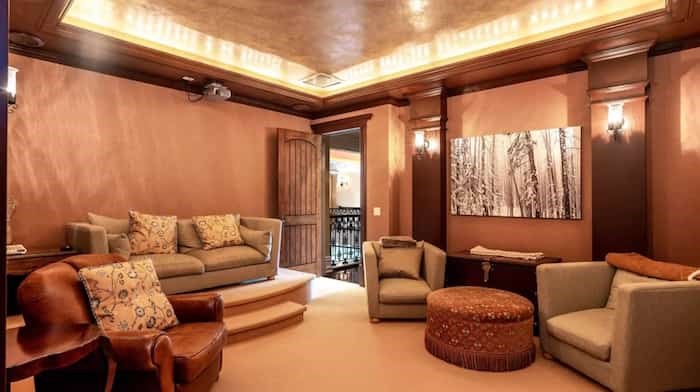  The home's movie theatre is decked out in a slightly more contemporary style, but still with elegant moldings and light fixtures. Source: Concierge Auctions