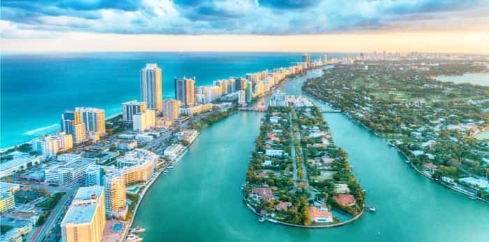  Miami Beach, wonderful aerial view of buildings, river and vegetation/ Shutterstock