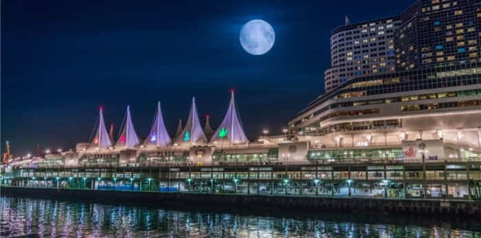 Vancouver BC Canada,October 4 2017.Canada place with full moon backgrounds / Shutterstock
