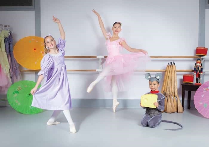  Dancers Tamara Ratkovic, Emma Ng, and Adelle Dosmagambetova glide through a recent dress rehearsal. The Nutcracker is a formative event for many young dancers, according to Goh Ballet director Chan Han Goh. - photo David Tresham