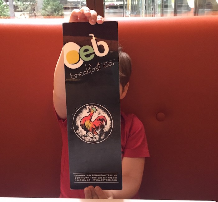  That just might be my kid modelling the OEB menu at their downtown Calgary location. Okay, fine, it is my kid. (Lindsay William-Ross/Vancouver Is Awesome)