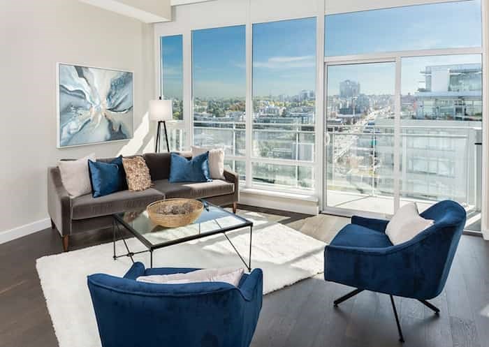  The living area of this penthouse's great room is sunny with floor-to-ceiling windows and a south-facing balcony