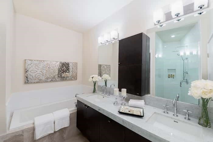  The master bathroom has marble counters, a soaker tub, a huge walk-in shower and a separated water closet