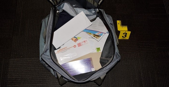  A bag of allegedly stolen mail was found at a Surrey home on Oct.11 and two people are charged with a number of mail theft offences. Photo courtesy Coquitlam RCMP