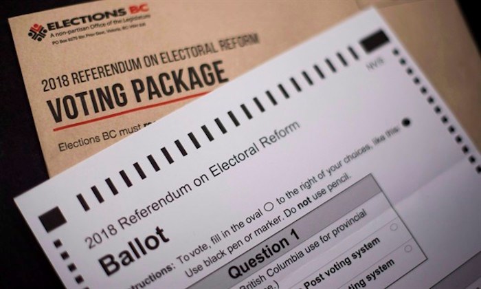  The 2018 Referendum on Electoral Reform package and mail in ballot from Elections B.C. is pictured in North Vancouver, B.C., Thursday, Nov. 1, 2018. THE CANADIAN PRESS /Jonathan Hayward