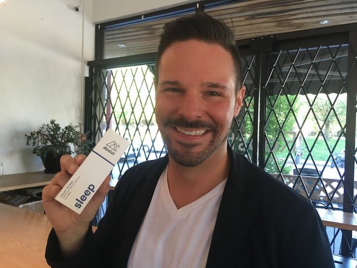  Dosist president Josh Campbell holds up a box with one of his vape pens at an event in East Vancouver in summer 2018. Photo by Glen Korstrom